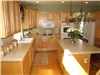 Old tile countertops and white appliances